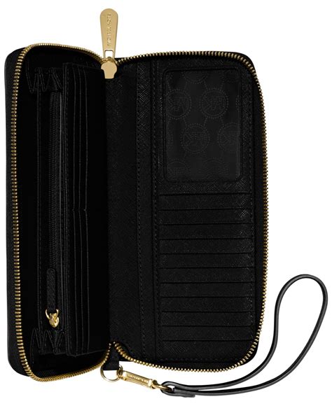 michael kors jet set travel continental leather black|michael kors airplane purse.